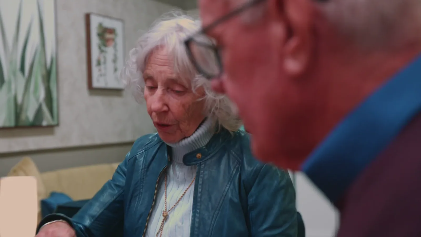 An older couple talking something through together
